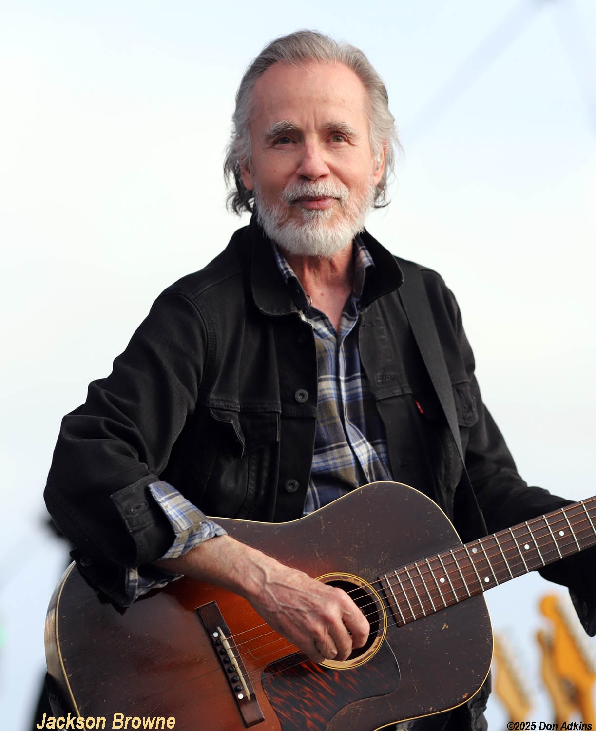 Jackson Browne performing live with acoustic guitar