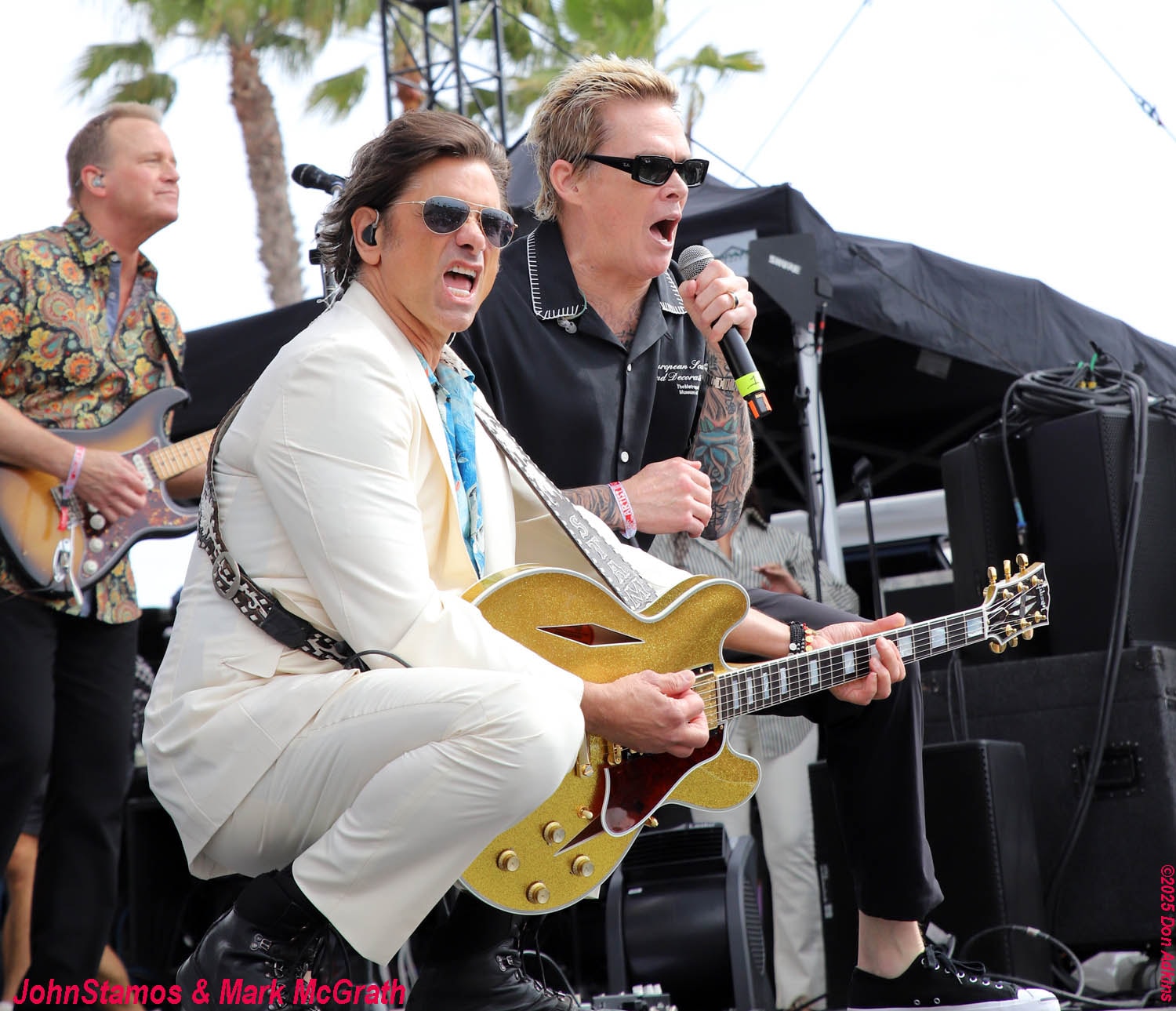 John Stamos and Mark McGrath performing live on stage