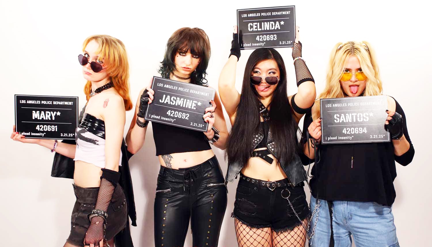 Band holding LAPD mugshot boards in studio